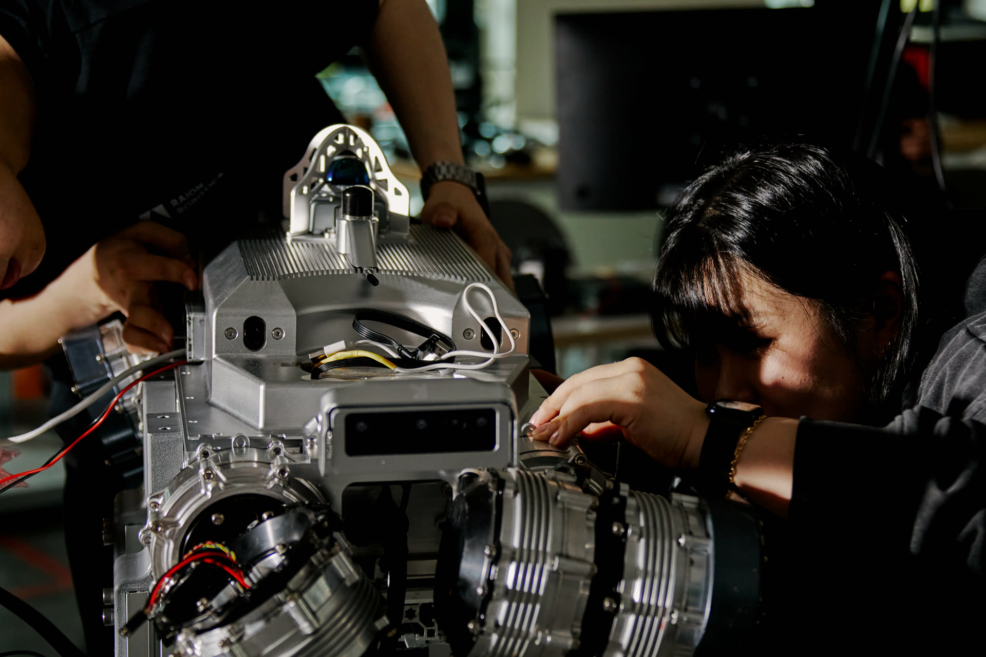 Raion Robotics engineers assembling a robot